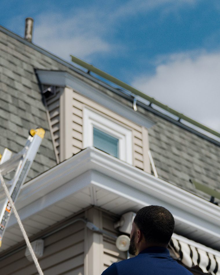 BHS crew working on a Massachusetts roof during a solar + roof project
