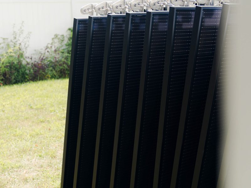 Solar panels staged on the ground before installation