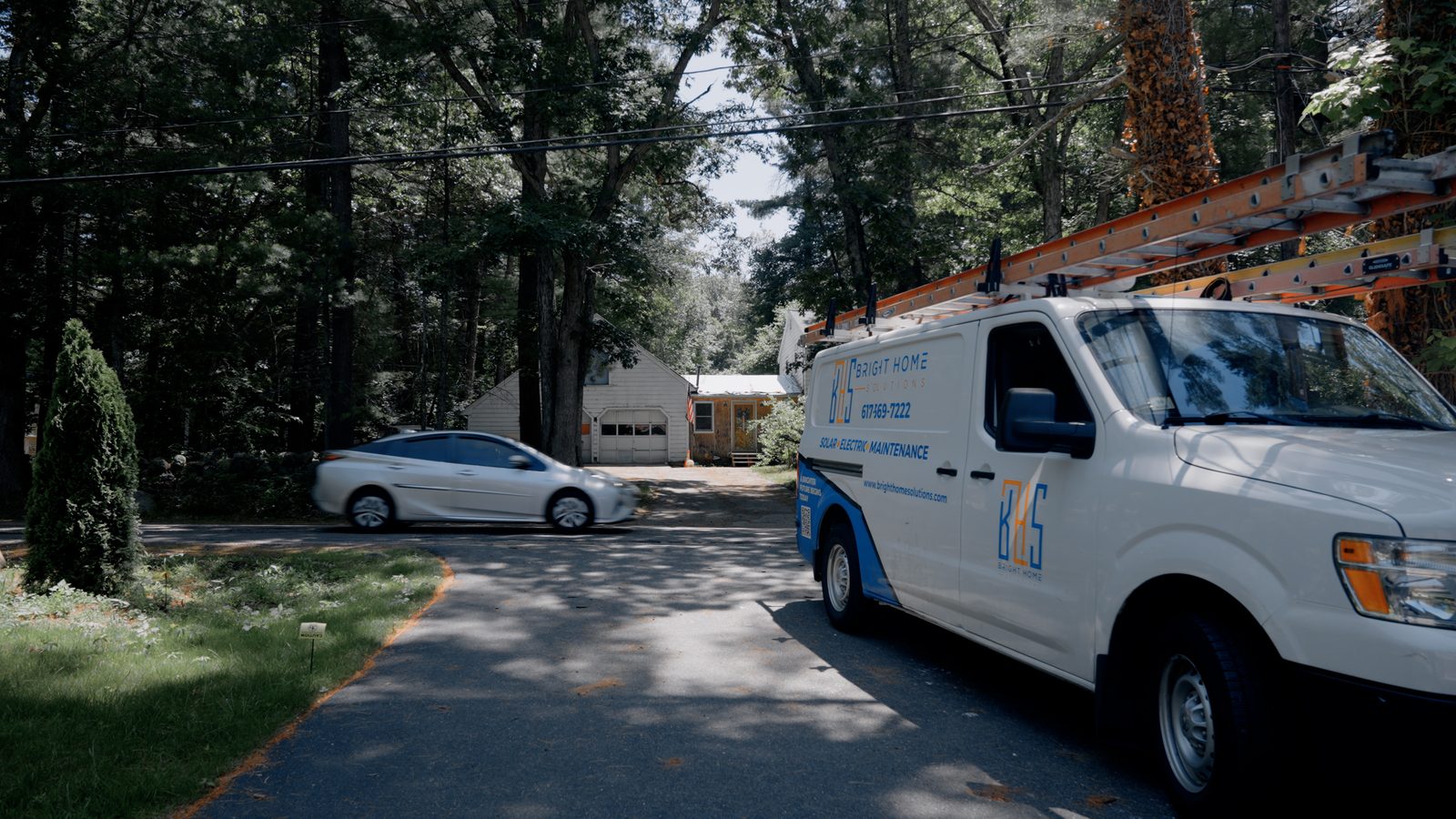 Bright Home Solutions service van on a Massachusetts street, lettered Solar Electric Maintenance